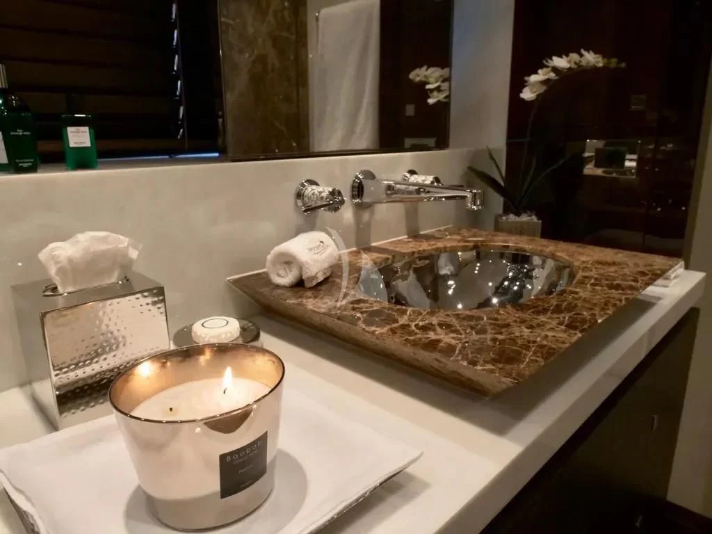 a bathroom sink with a mirror aboard ROCKET Yacht for Sale