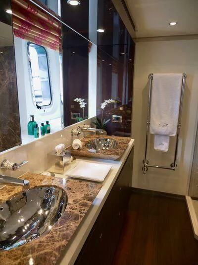a bathroom with sinks and mirrors aboard ROCKET Yacht for Sale