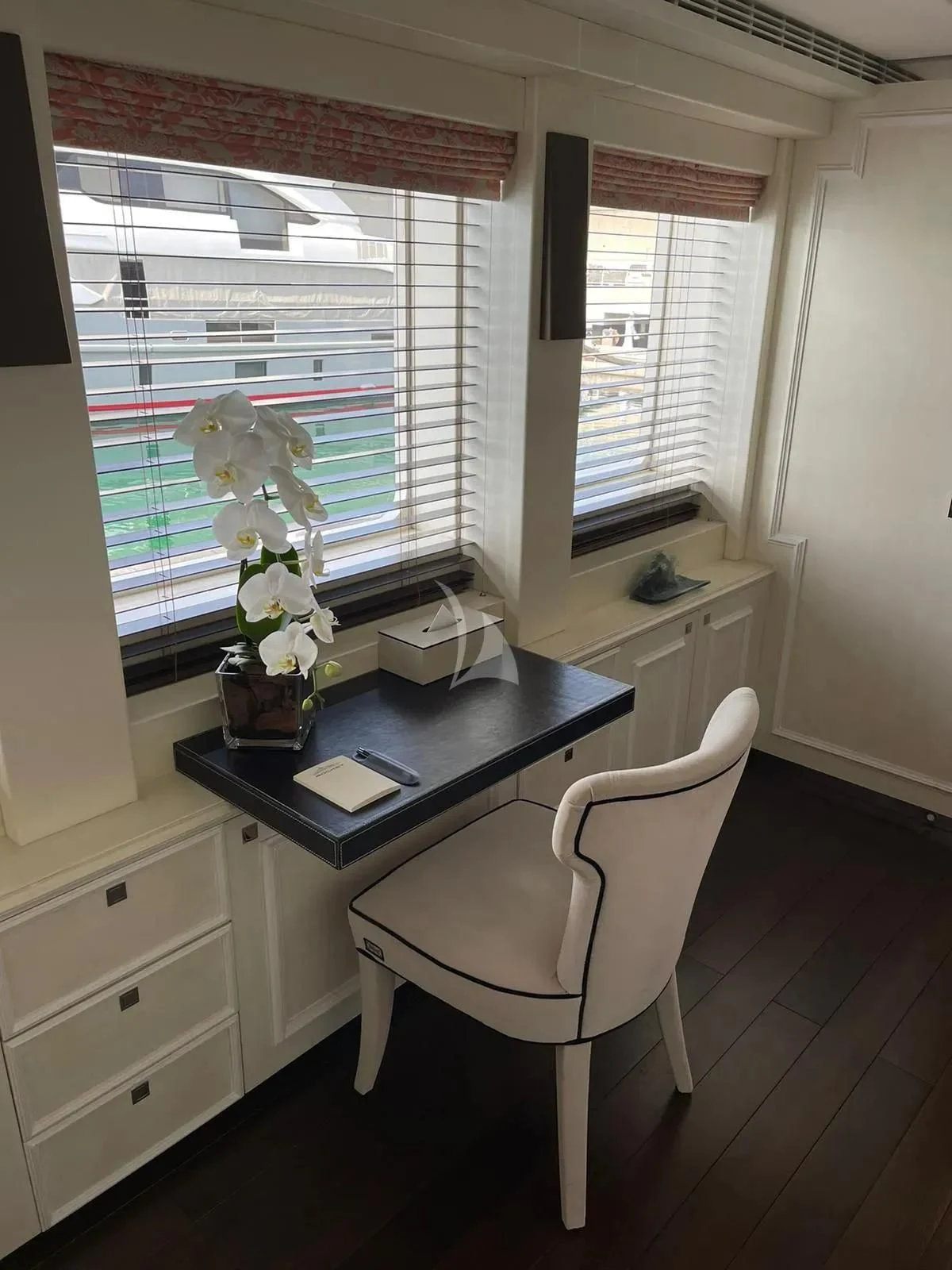 a desk with a laptop on it aboard ROCKET Yacht for Sale