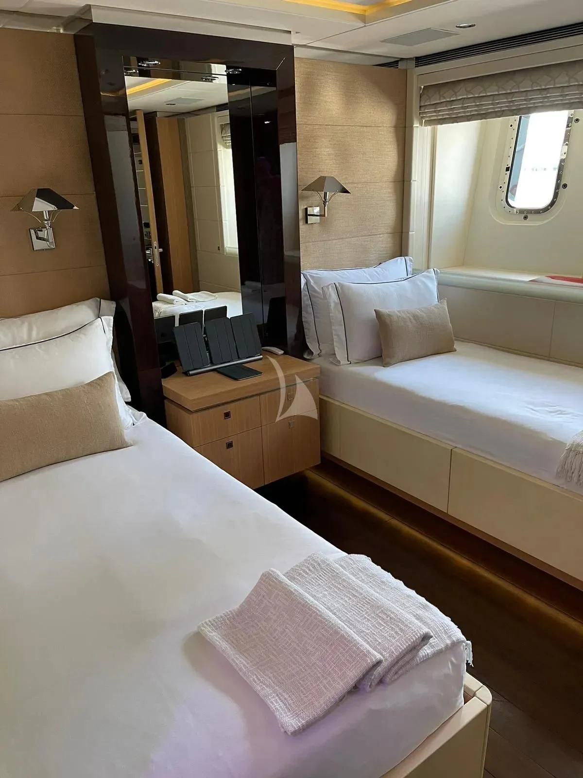a room with a bed and a desk aboard ROCKET Yacht for Sale