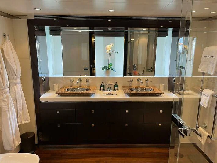 a bathroom with a large mirror aboard ROCKET Yacht for Sale