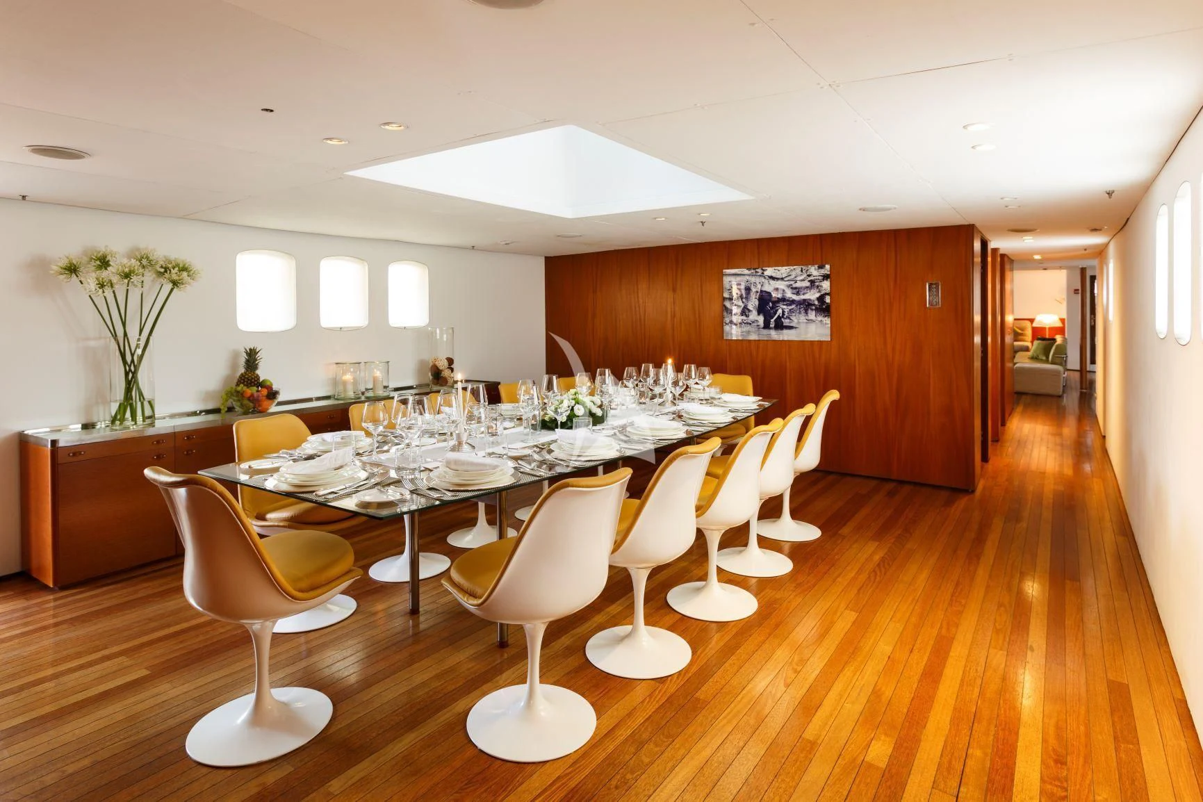 a room with tables and chairs aboard DIONEA Yacht for Sale
