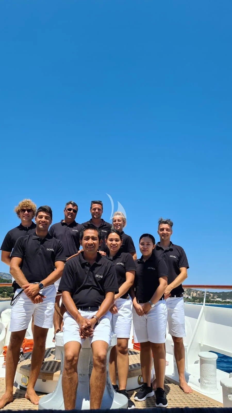 a group of people posing for a photo aboard DIONEA Yacht for Sale