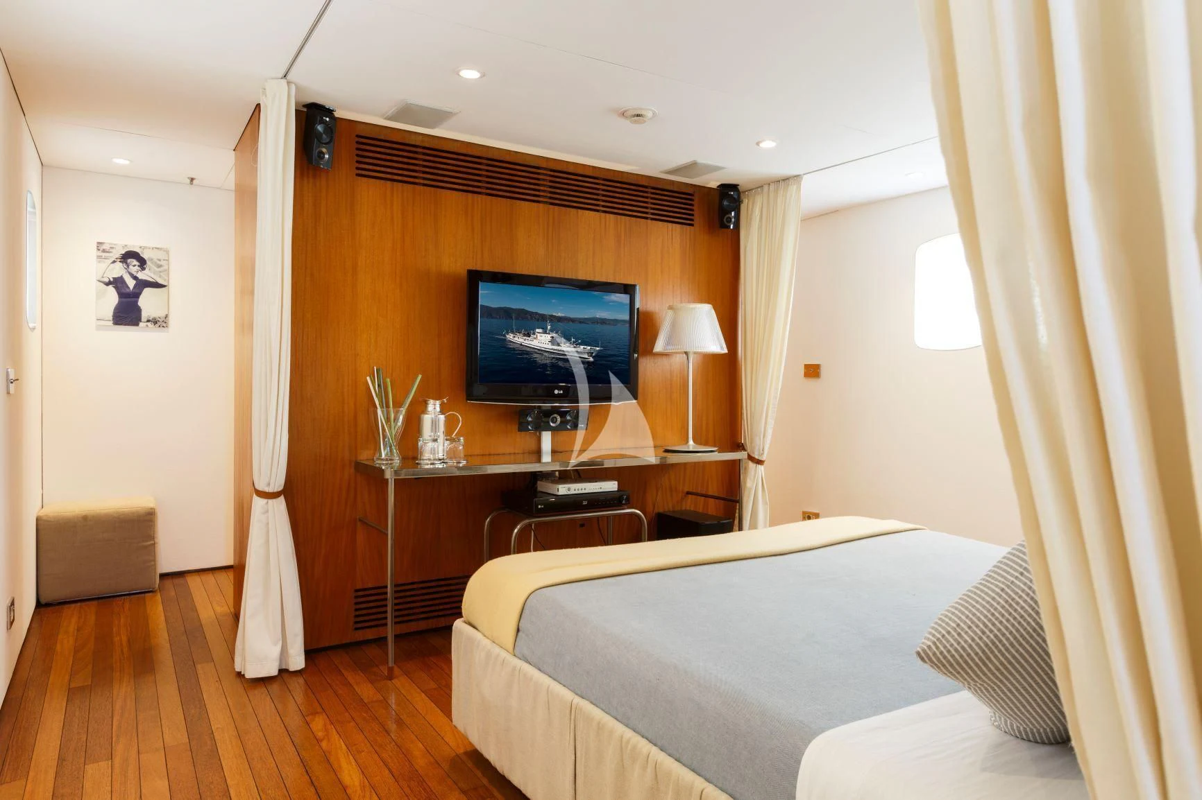 a bedroom with a bed and a television aboard DIONEA Yacht for Sale