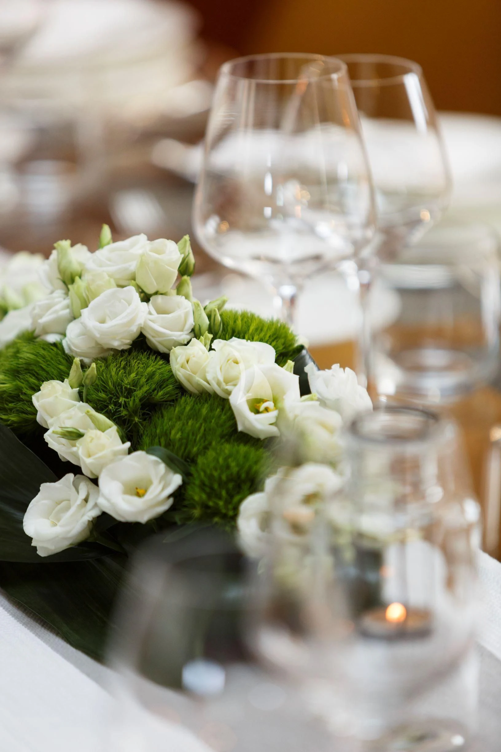 a table with flowers and glasses aboard DIONEA Yacht for Sale