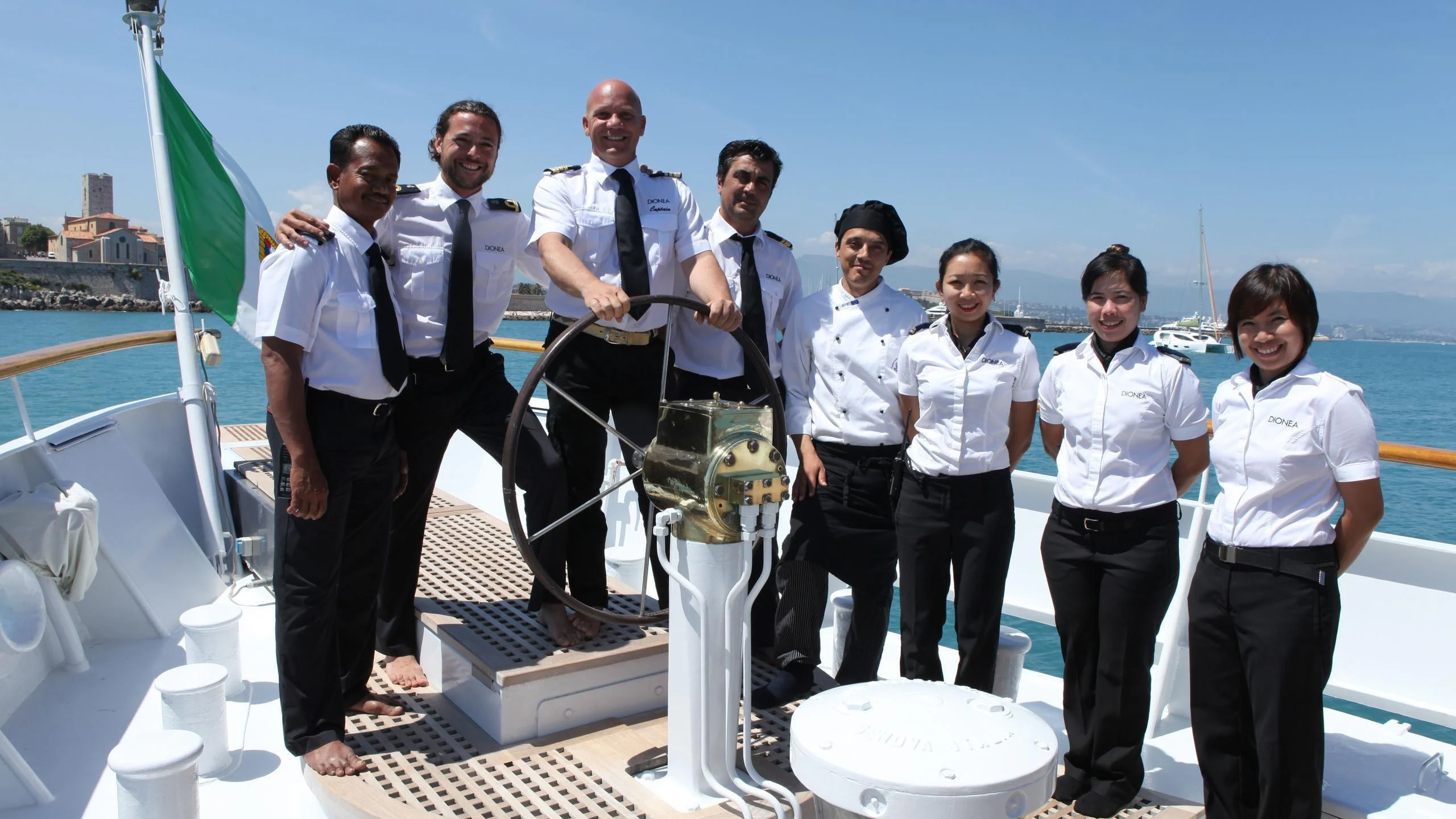 a group of people posing for a photo aboard DIONEA Yacht for Sale