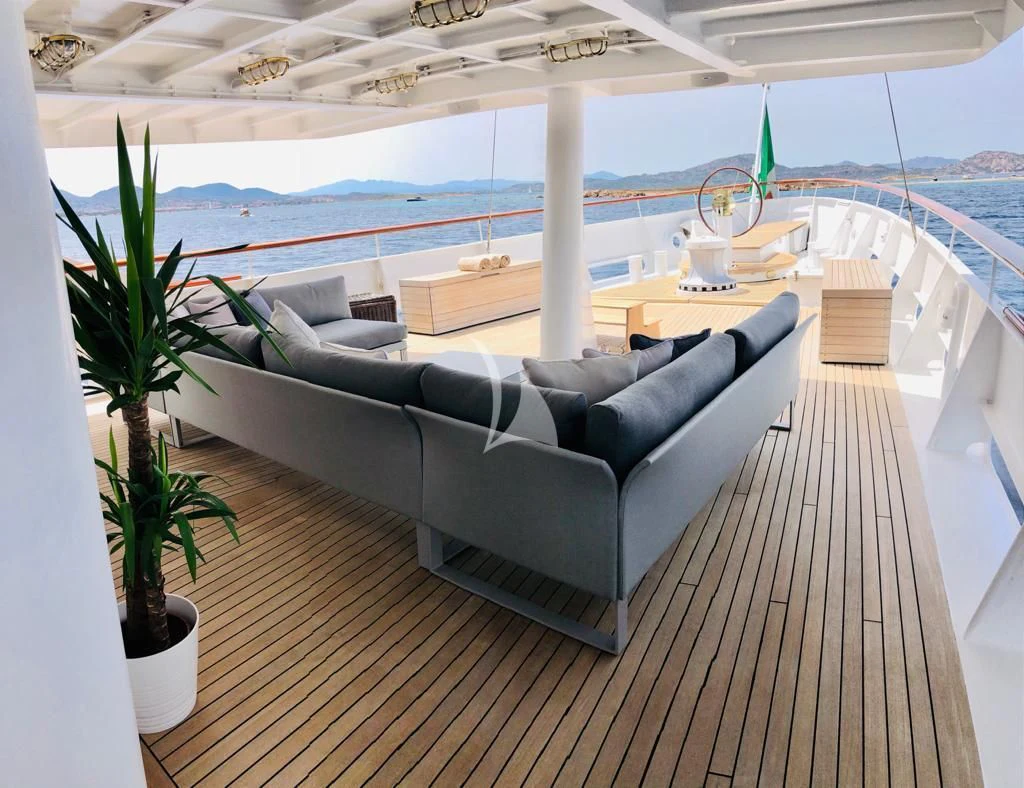 a large living room with a large balcony aboard DIONEA Yacht for Sale