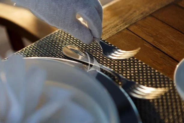 a pair of silver scissors on a blue fabric surface aboard DIONEA Yacht for Sale