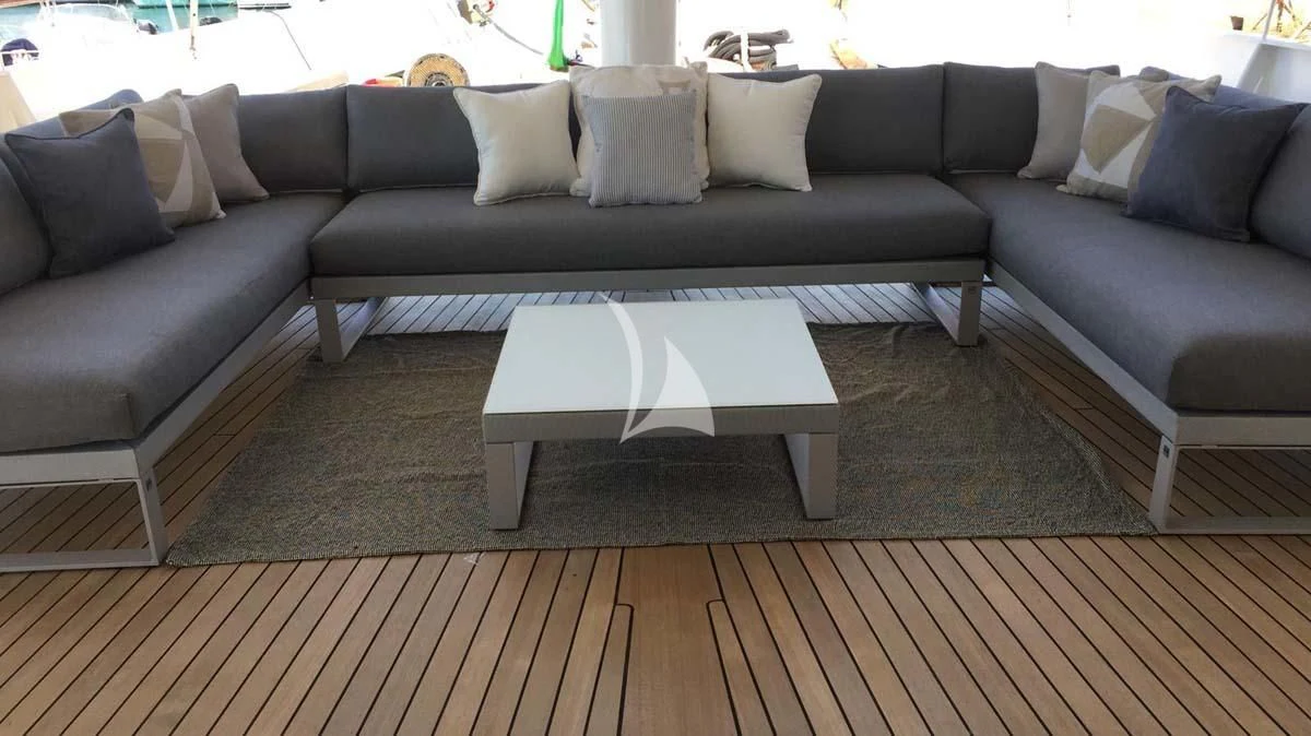a couch with a coffee table aboard DIONEA Yacht for Sale