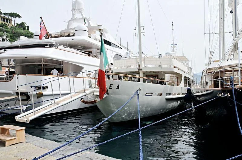 a boat docked at a pier aboard DIONEA Yacht for Sale