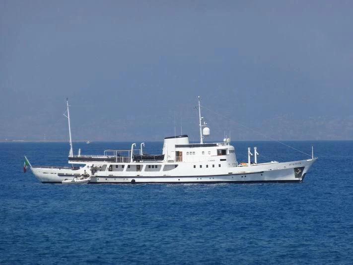 a large white boat in the water aboard DIONEA Yacht for Sale