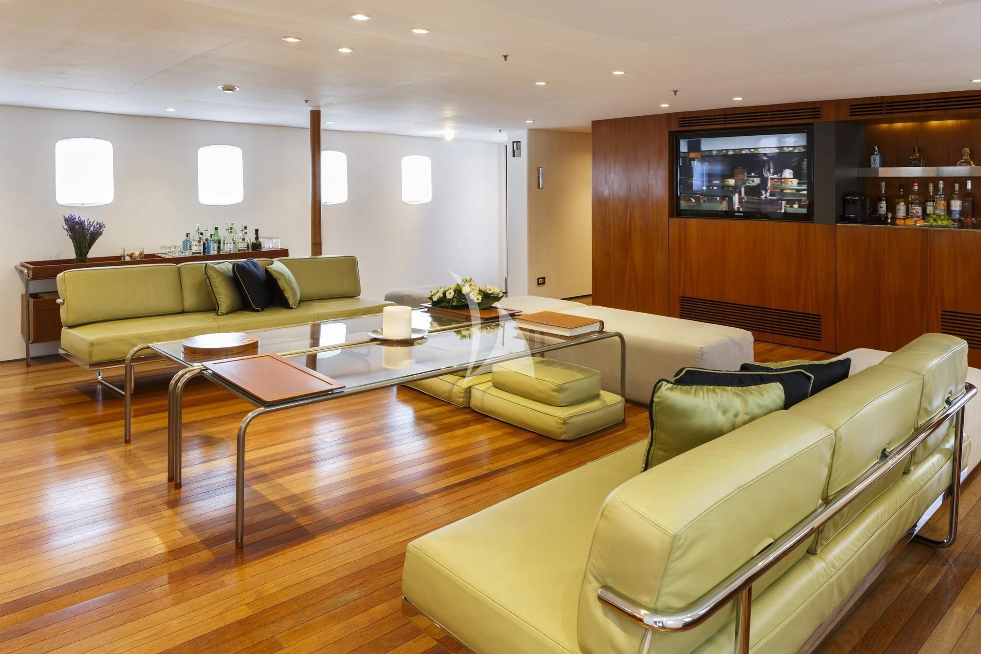 a living room with a table and couches aboard DIONEA Yacht for Sale