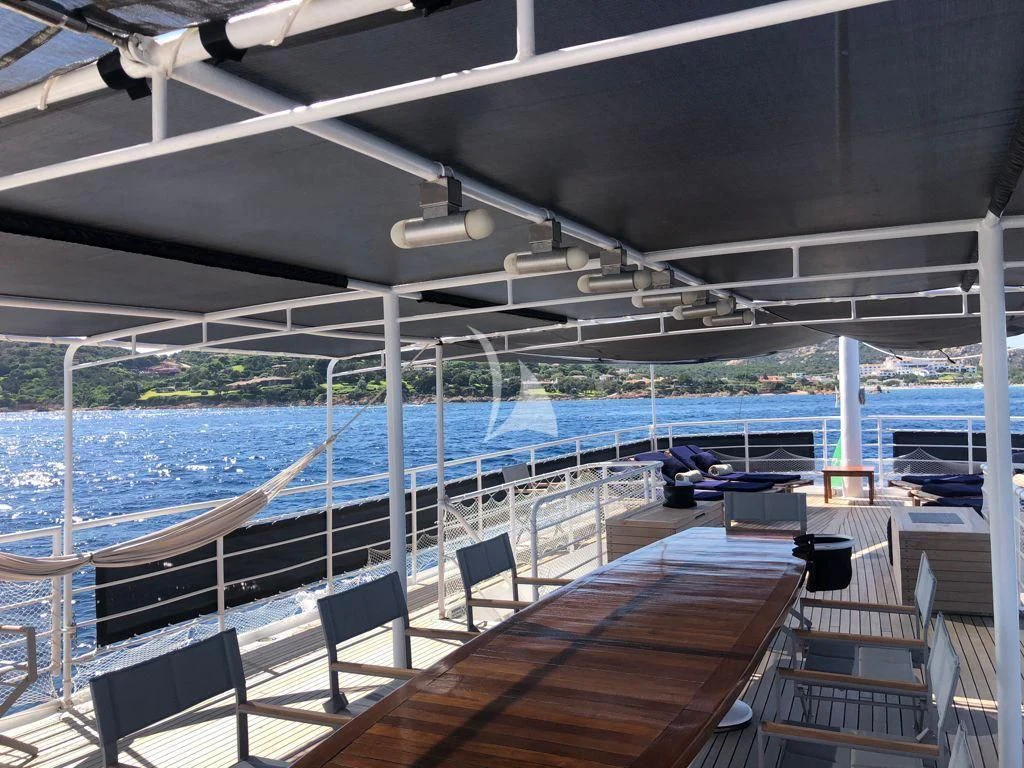 a deck with a pool and a deck aboard DIONEA Yacht for Sale