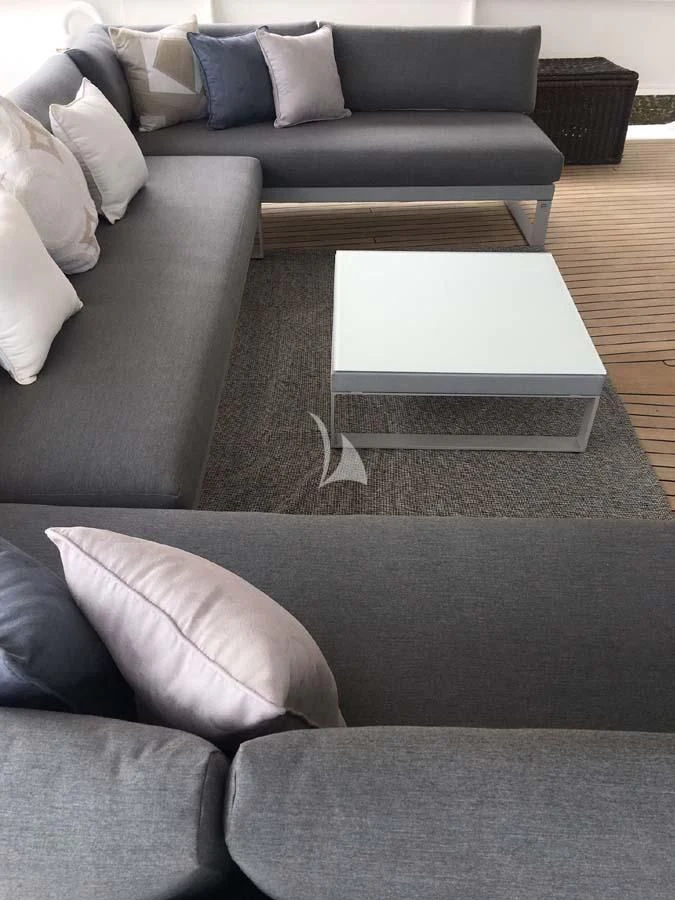 a couch with a coffee table aboard DIONEA Yacht for Sale