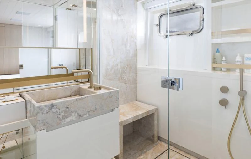 a bathroom with a sink and a mirror aboard ELA & SEA Yacht for Sale