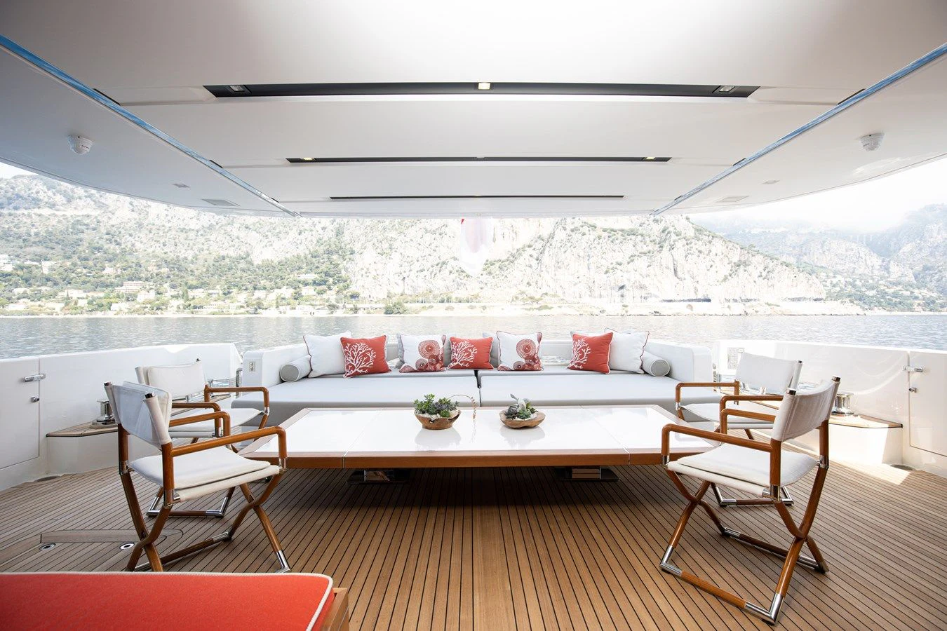 a room with a couch and a table and chairs aboard ELA & SEA Yacht for Sale
