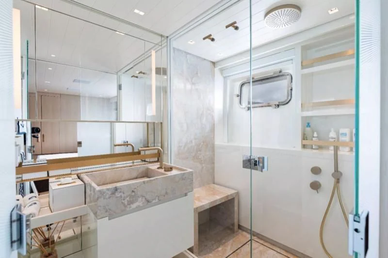 a bathroom with a sink and a shower unit aboard ELA & SEA Yacht for Sale