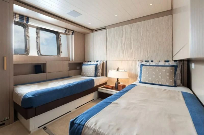 a couple of beds in a room aboard ELA & SEA Yacht for Sale