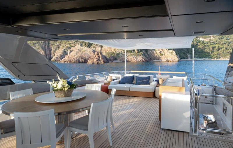 a table and chairs on a boat aboard ELA & SEA Yacht for Sale