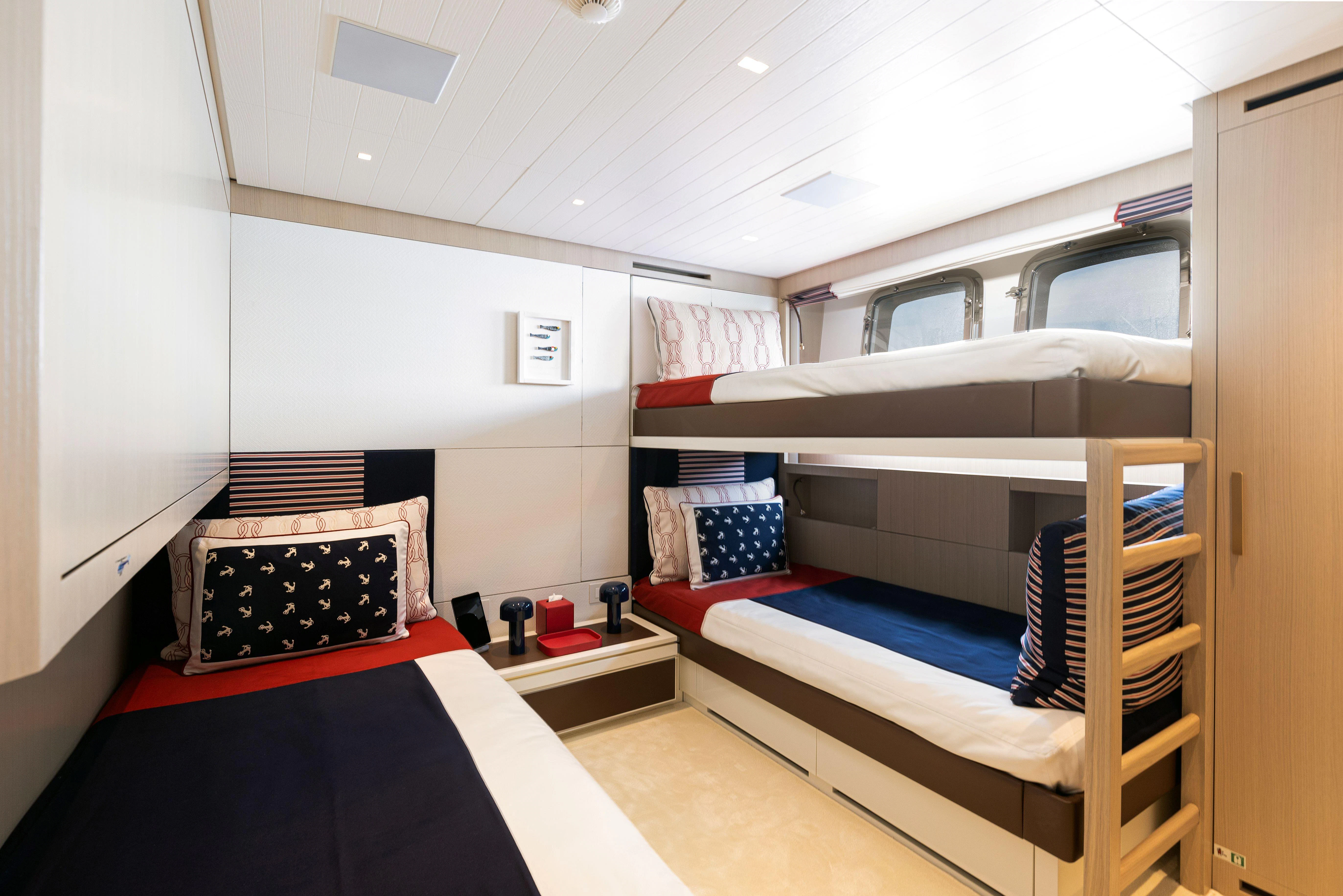 a room with bunk beds aboard ELA & SEA Yacht for Sale