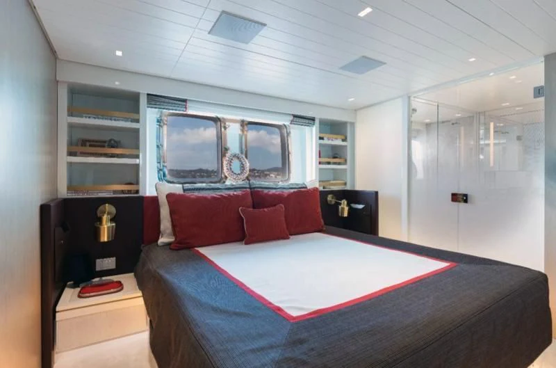 a bed in a room aboard ELA & SEA Yacht for Sale