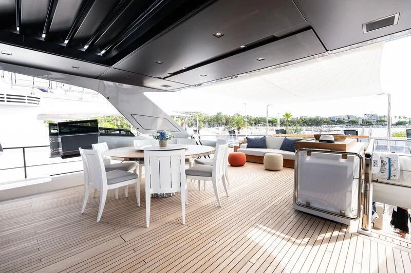 a room with a table and chairs aboard ELA & SEA Yacht for Sale