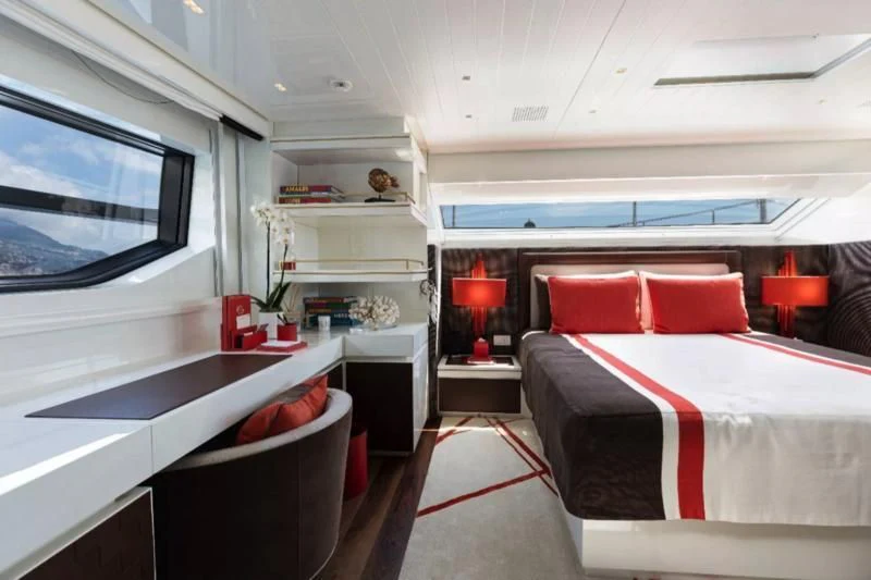 a room with a bed and a tv aboard ELA & SEA Yacht for Sale