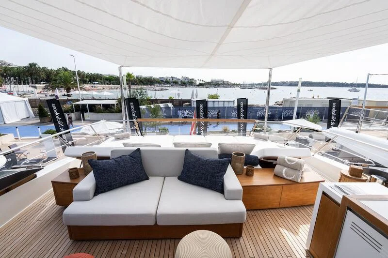 a room with a couch and a pool aboard ELA & SEA Yacht for Sale