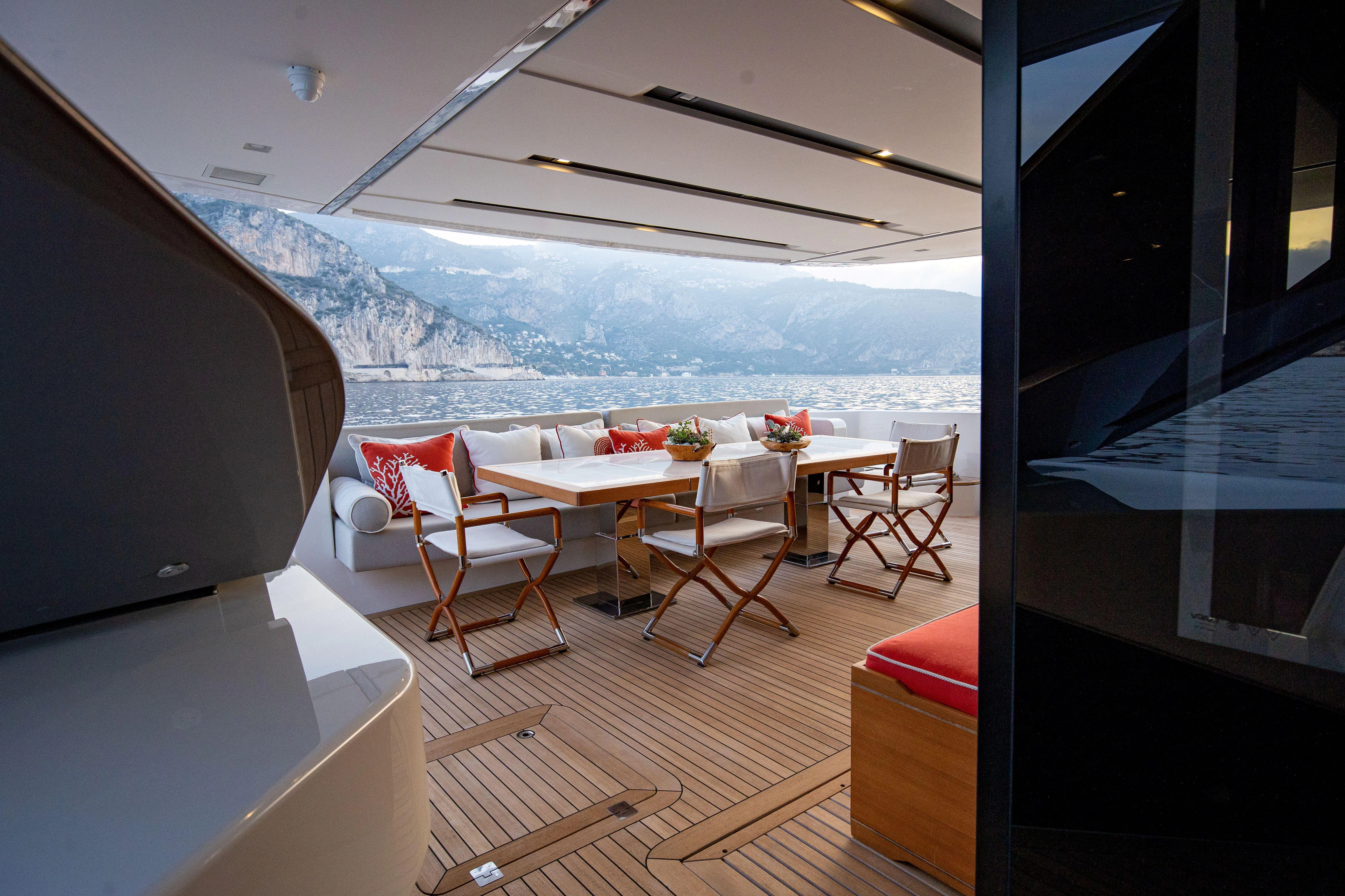 a room with a table and chairs aboard ELA & SEA Yacht for Sale