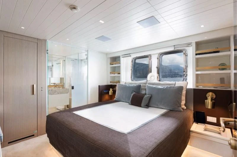 a large bed in a room aboard ELA & SEA Yacht for Sale
