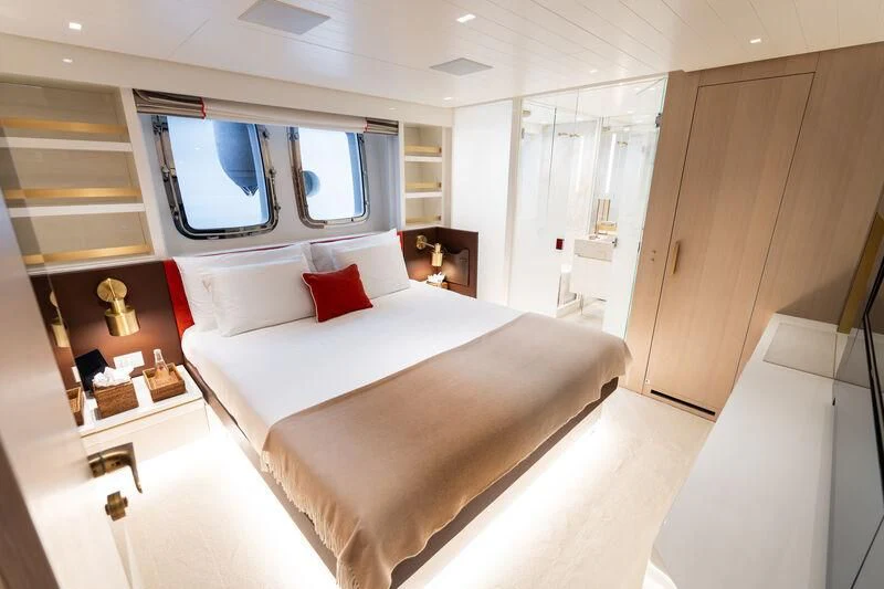 a large bed in a room aboard ELA & SEA Yacht for Sale
