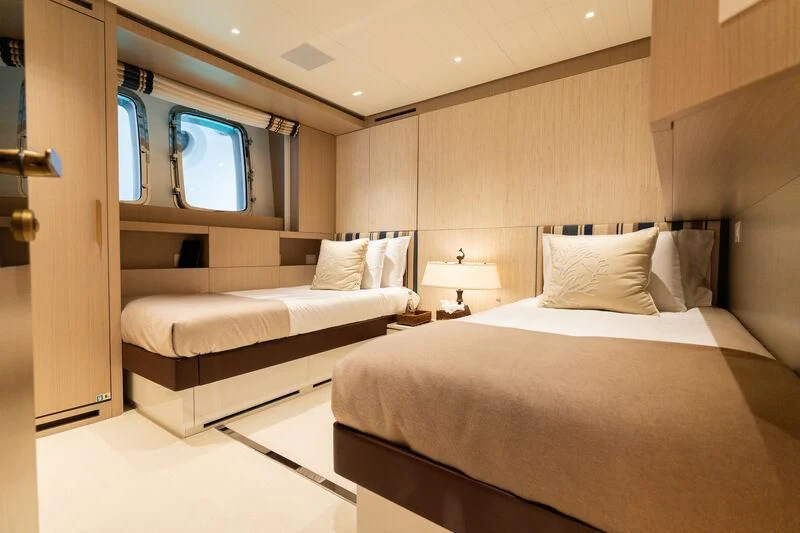 a room with two beds aboard ELA & SEA Yacht for Sale