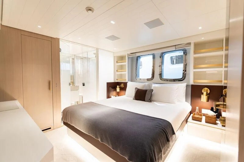 a bedroom with a large bed aboard ELA & SEA Yacht for Sale