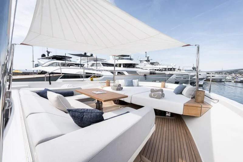 a large white tent with a deck overlooking a marina aboard ELA & SEA Yacht for Sale