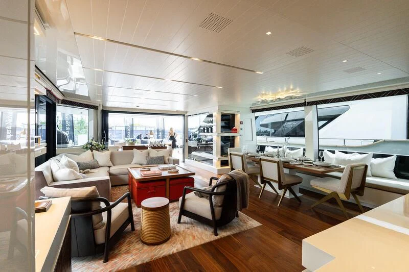 a living room with a large window aboard ELA & SEA Yacht for Sale