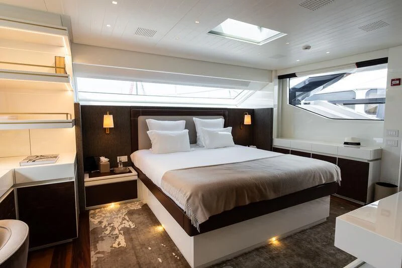 a room with a bed and a desk aboard ELA & SEA Yacht for Sale