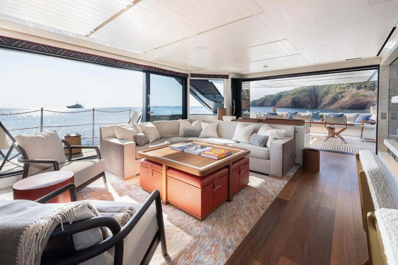 a living room with a large window aboard ELA & SEA Yacht for Sale