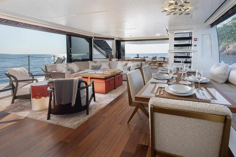 a dining room with a table and chairs aboard ELA & SEA Yacht for Sale