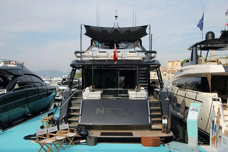 a boat with a large black object on it aboard NERO Yacht for Sale
