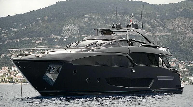 a black and white boat on a beach aboard NERO Yacht for Sale