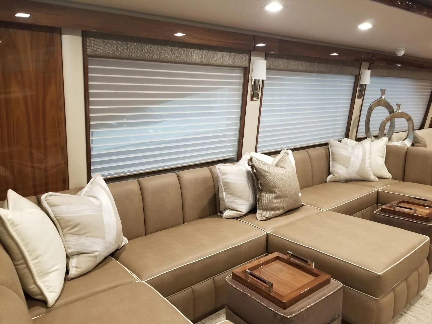 a couch with pillows and a mirror aboard AFTER MIDNIGHT Yacht for Sale