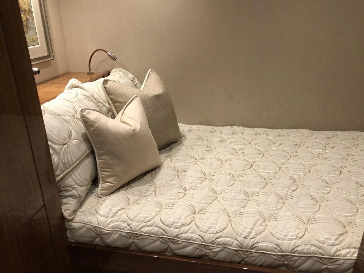 a bed with white sheets aboard AFTER MIDNIGHT Yacht for Sale
