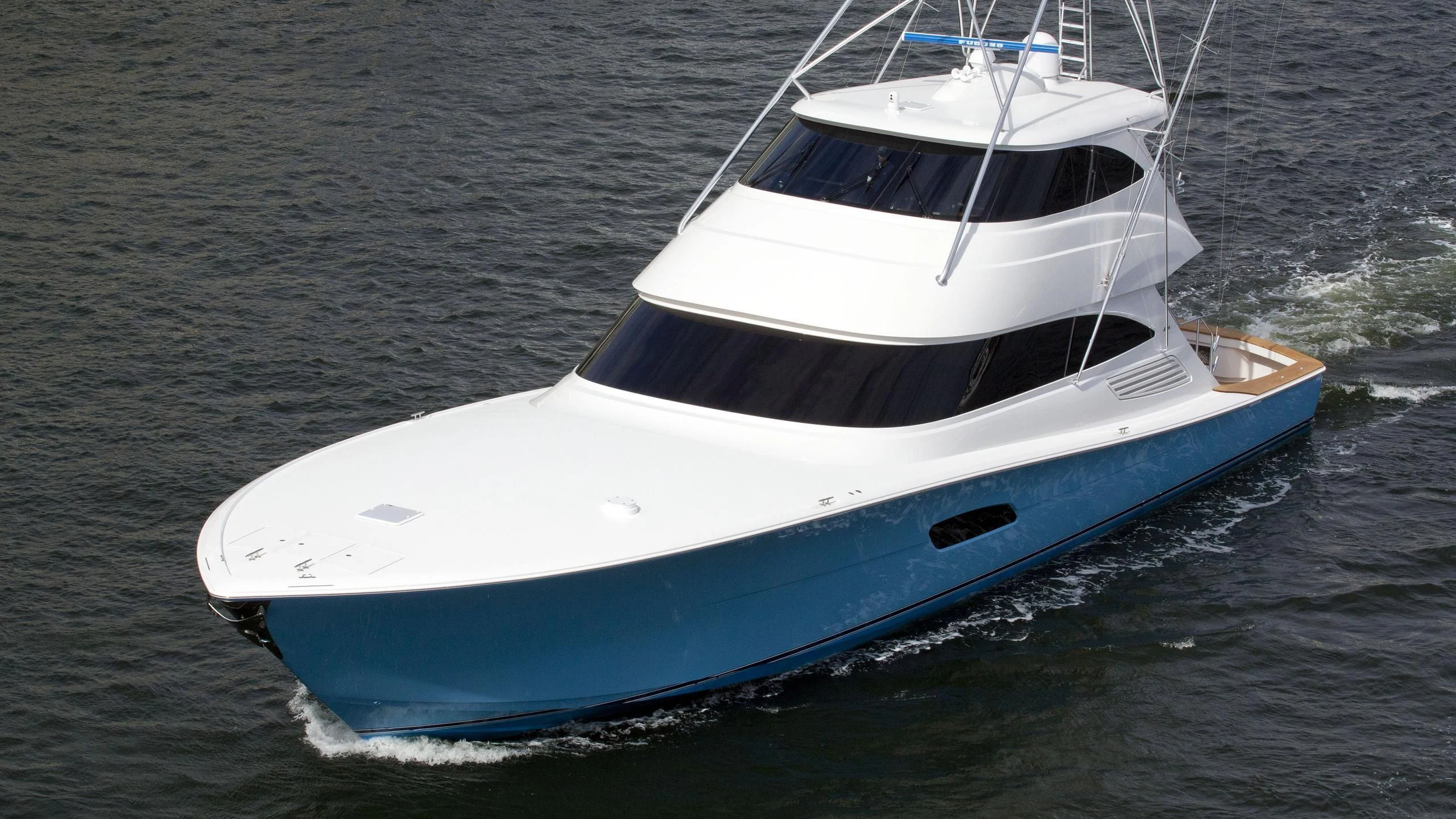 a white boat in the water aboard AFTER MIDNIGHT Yacht for Sale