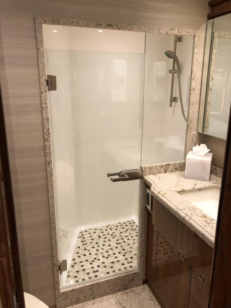a shower unit in a bathroom aboard AFTER MIDNIGHT Yacht for Sale