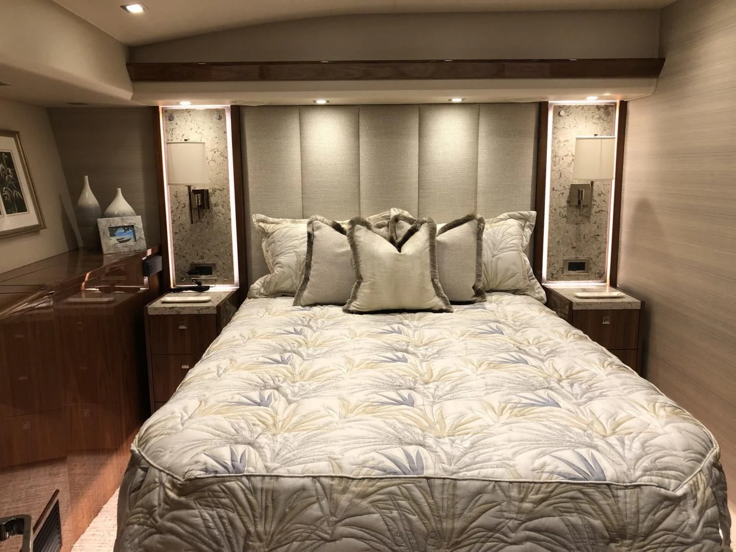 a bed with white sheets aboard AFTER MIDNIGHT Yacht for Sale