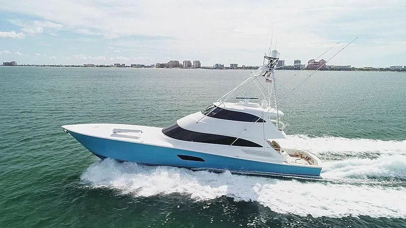 a white boat on the water aboard AFTER MIDNIGHT Yacht for Sale