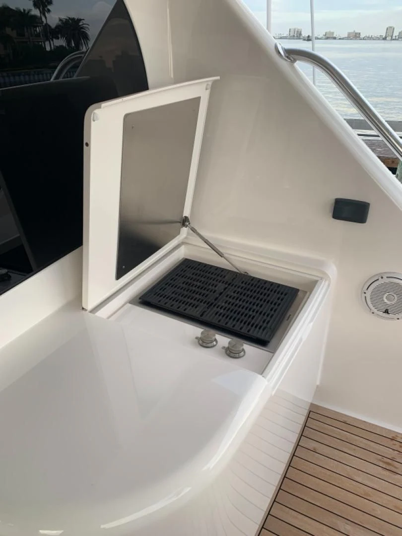 a laptop on a car aboard AFTER MIDNIGHT Yacht for Sale