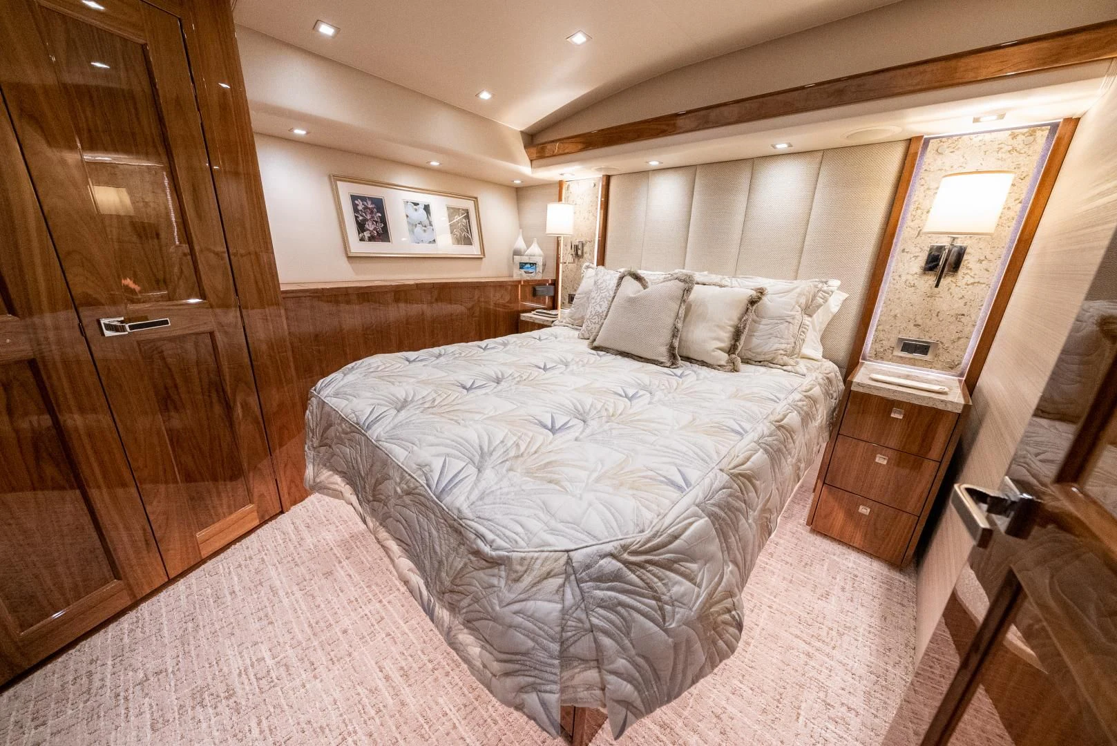 a large bedroom with a large bed aboard AFTER MIDNIGHT Yacht for Sale