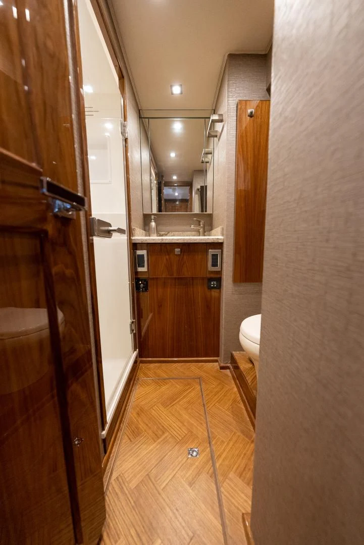 a bathroom with a shower and sink aboard AFTER MIDNIGHT Yacht for Sale