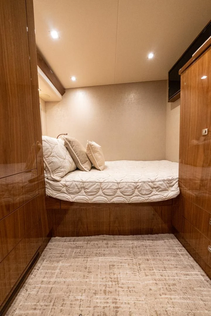 a bed in a room aboard AFTER MIDNIGHT Yacht for Sale